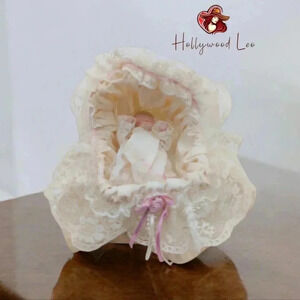 Porcelain Baby Doll Infant in Cradle Rocking metal frame